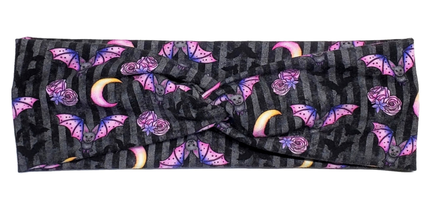 Pastel goth bats roses and moons on a black and grey striped headband for women