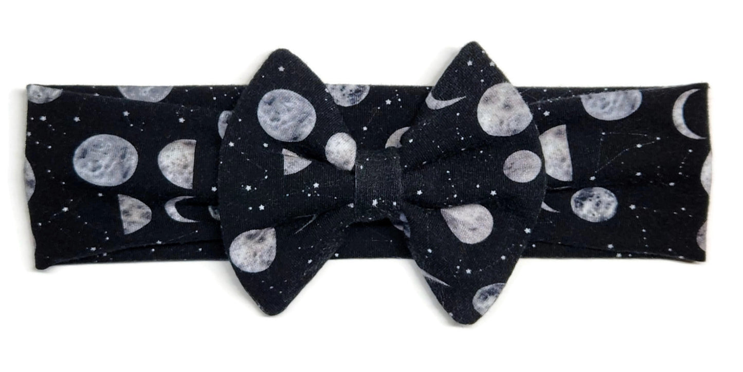 Moons and constellations on a baby headband with bow