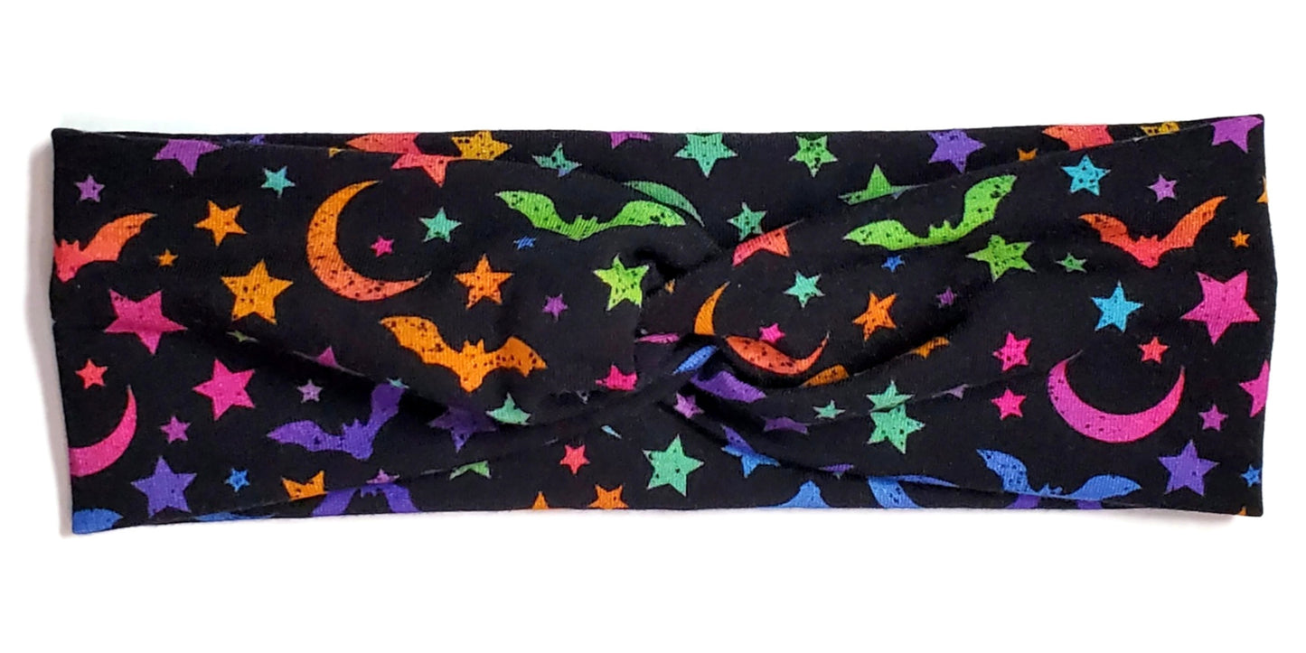 Rainbow bat silhouettes on a black twist headwrap headband for women