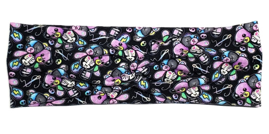 Pastel goth skeleton teddy bears on a black cotton twist headband for women